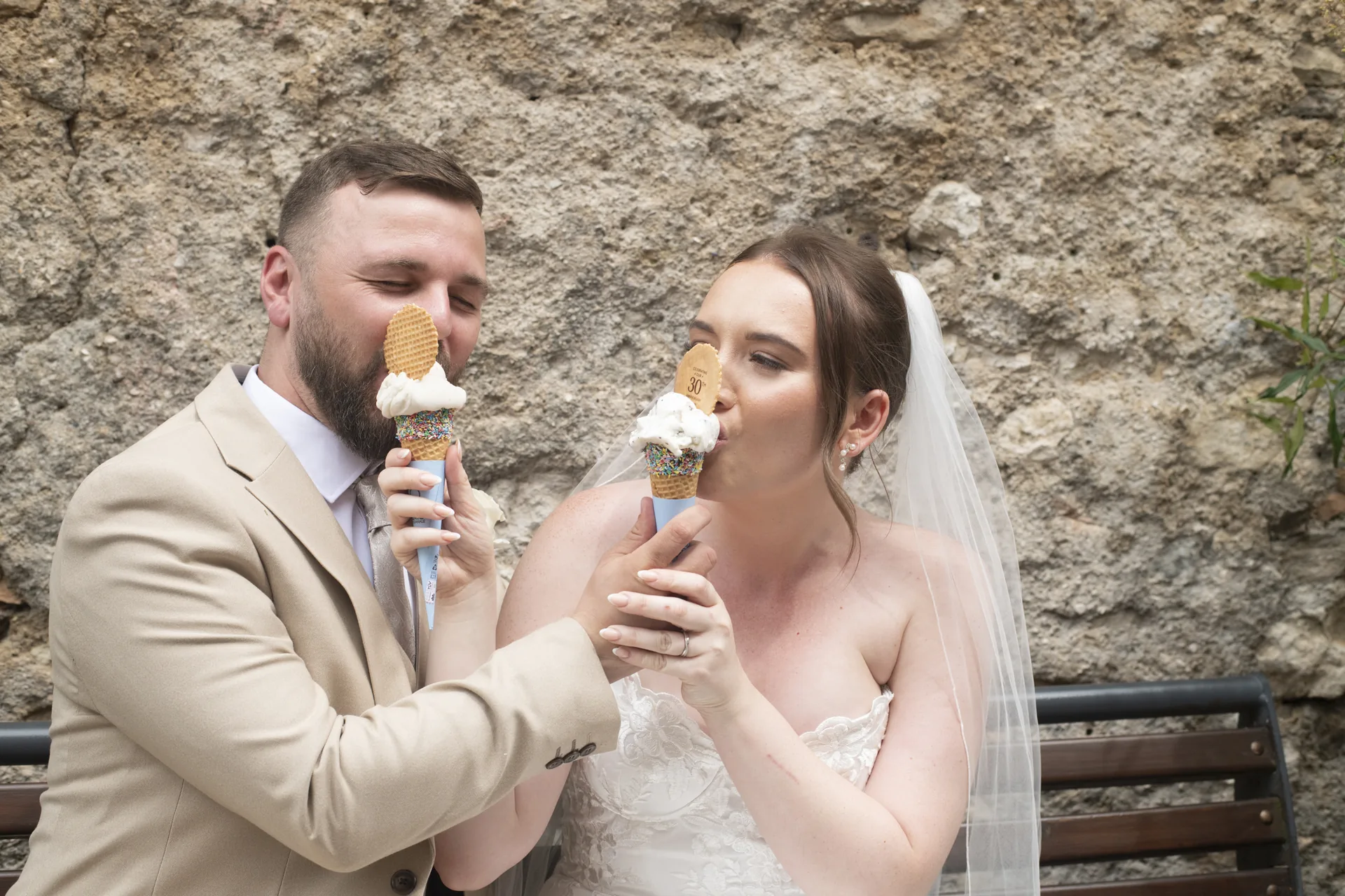 Bride and groom on the castle terrace above Lake Garda