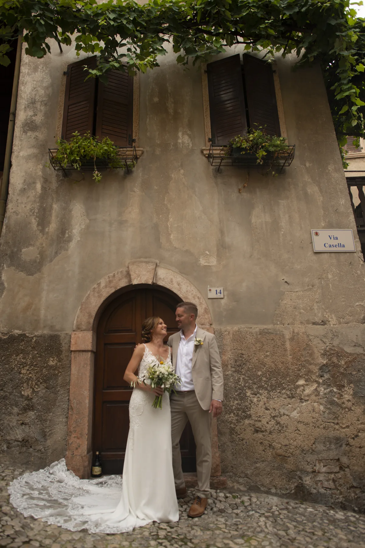 A couple framed by an old Italian doorway