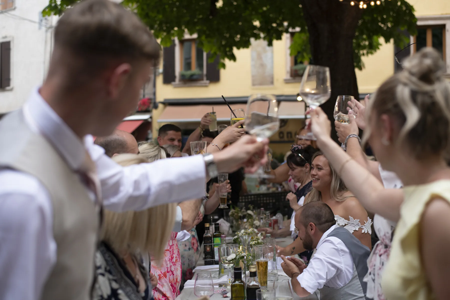 Guests raising a toast to the newlyweds