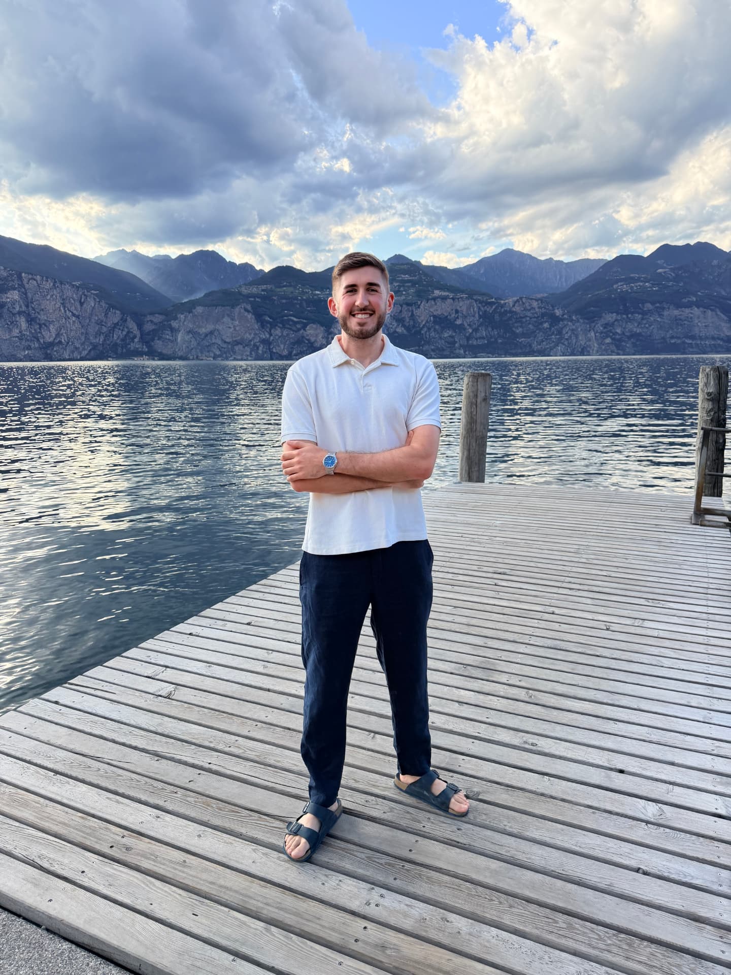 Etienne, content creator at Lake Garda Weddings, on the jetty at sunset