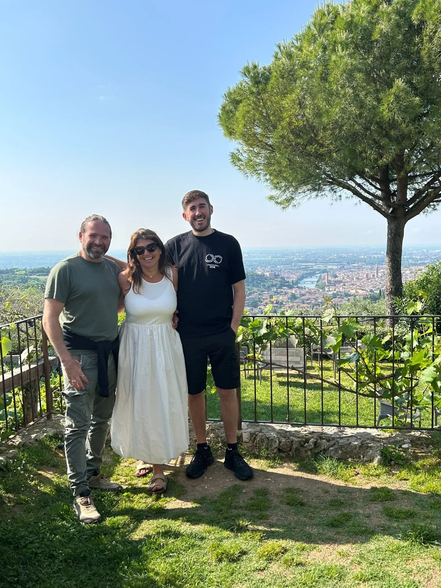 Dulcie, Nathan and Etienne together on a hilltop overlooking Verona