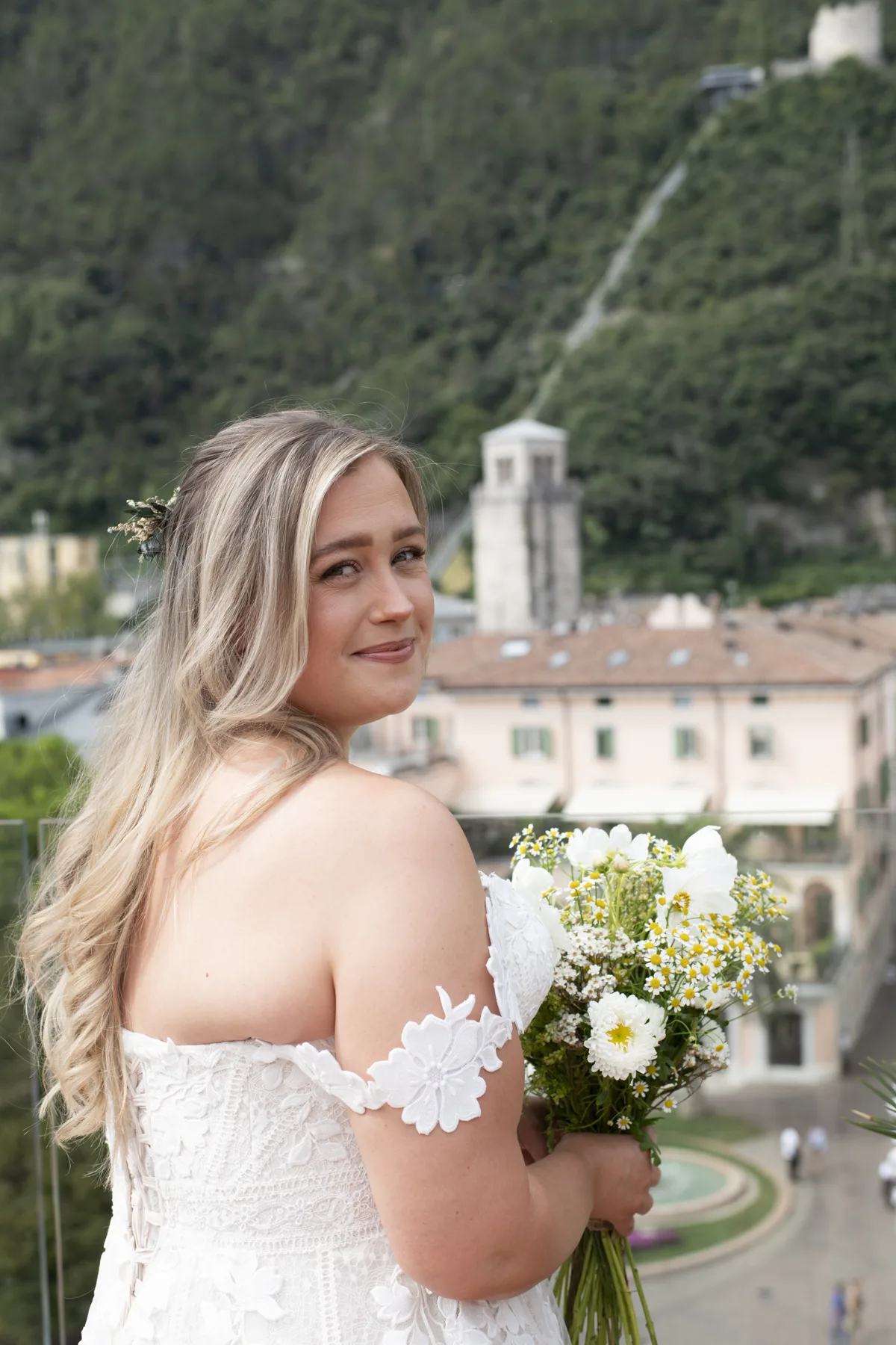 A bride holding her bouquet before the ceremony