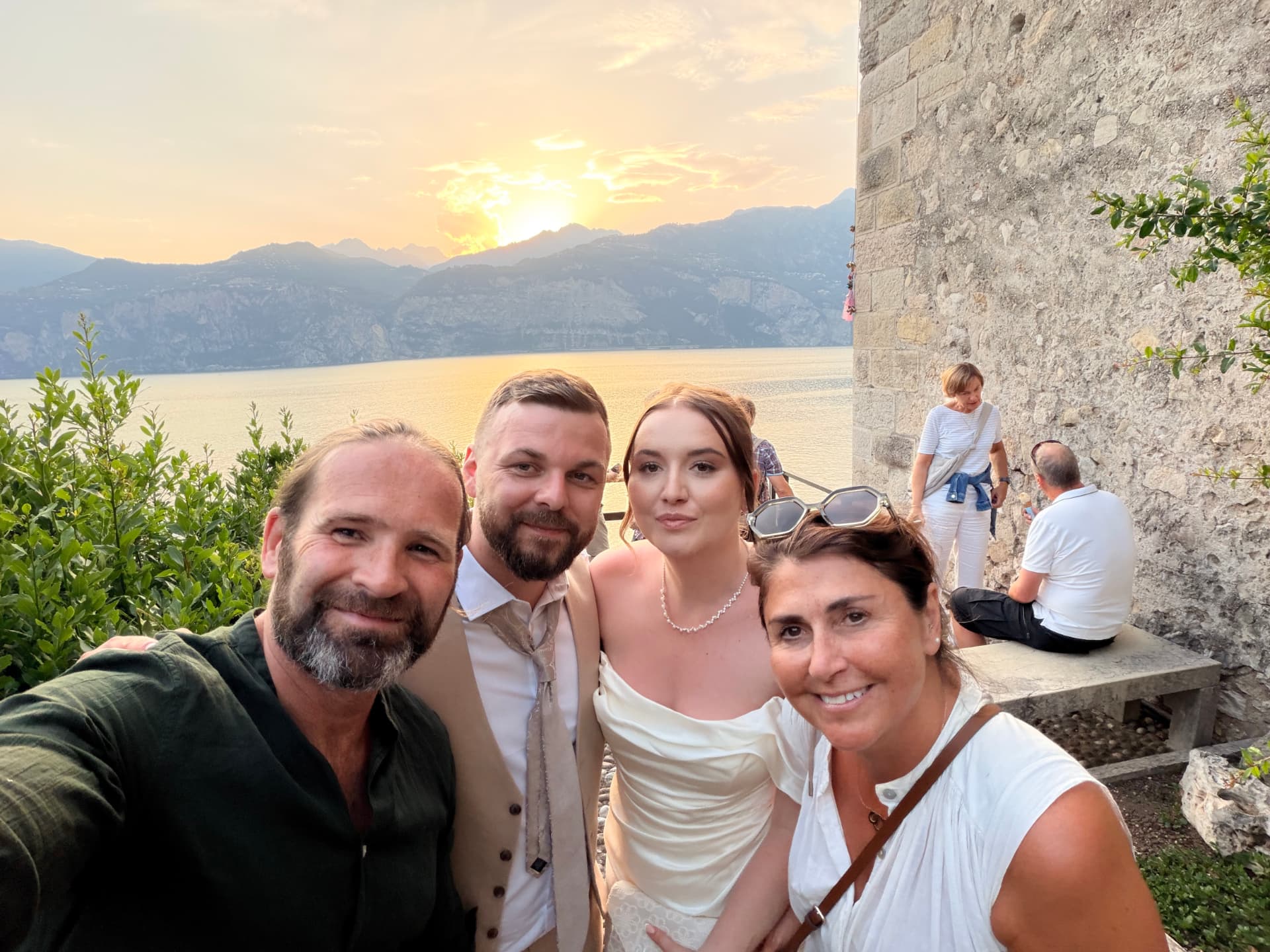 Nathan with family and friends at sunset on Lake Garda