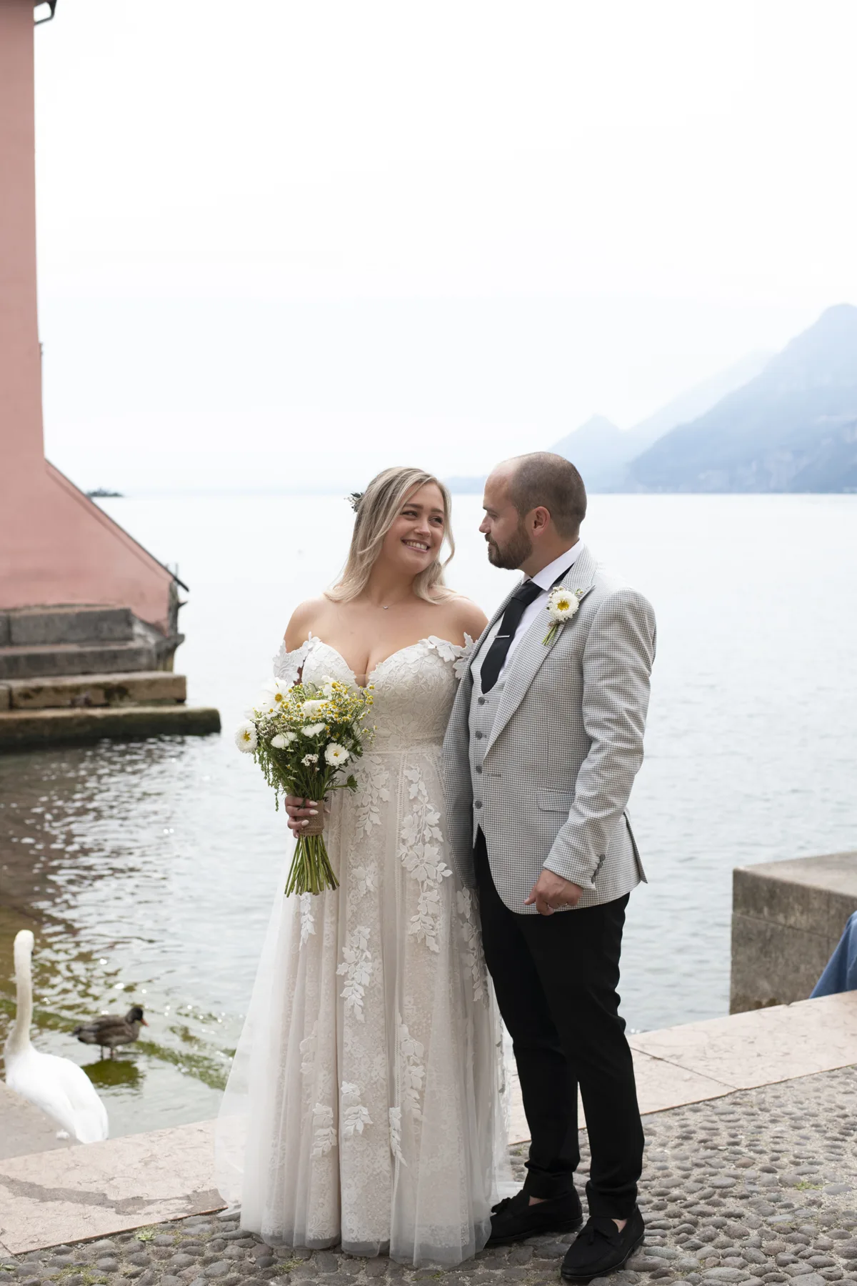 Newlyweds beside the water moments after their ceremony